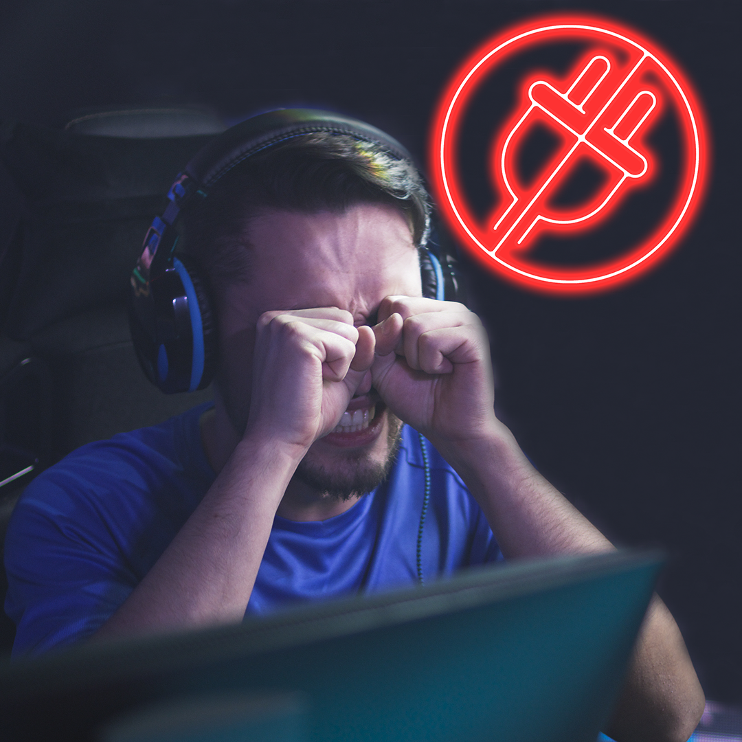How to troubleshoot no power issues - frustrated person at pc overlaid with symbol for a plug with a circle around it and a line crossed through it in red.